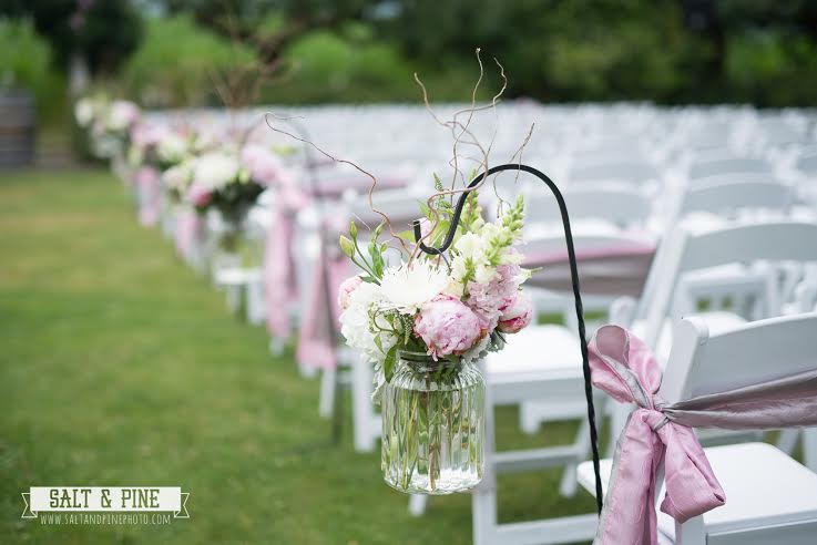 Flowers and Sashes on Aisle Chair