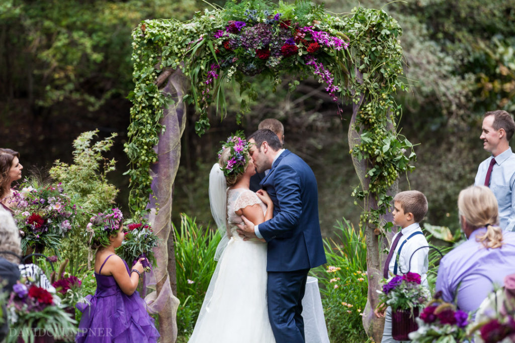 Floral Crowns and Floral Arch at Four Seasons Lake Perserve on Camano Island Wedding First Kiss