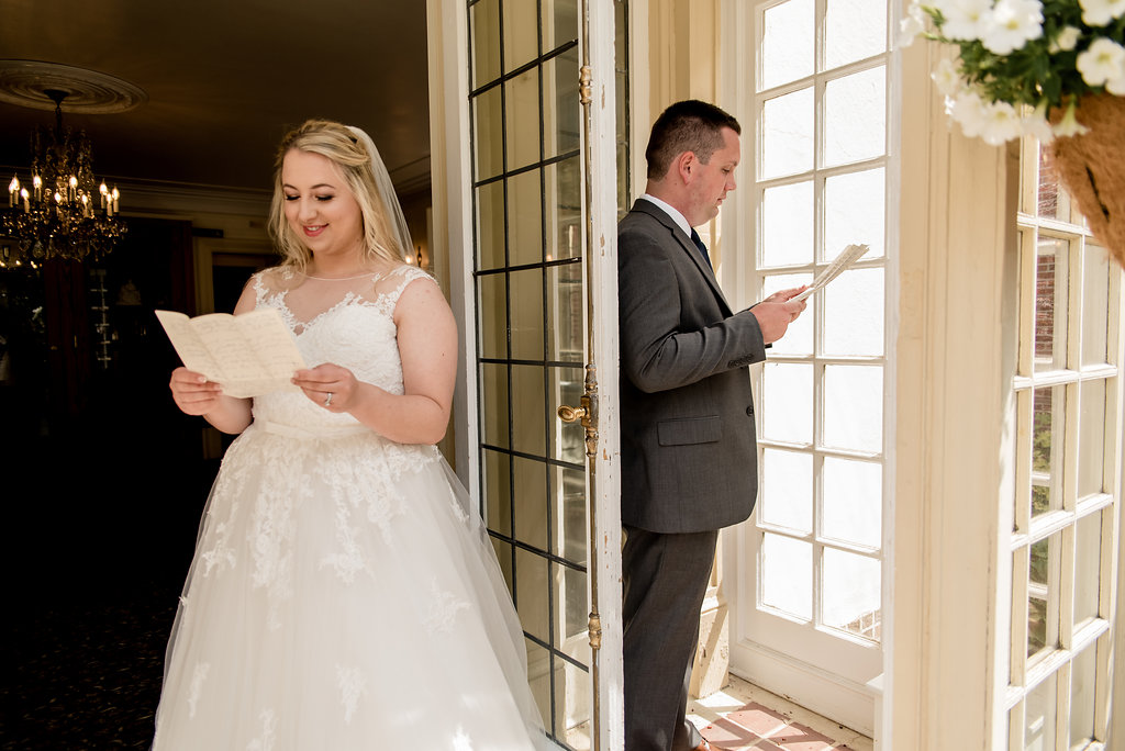 First look with love notes for wedding couple at Lairmont Manor
